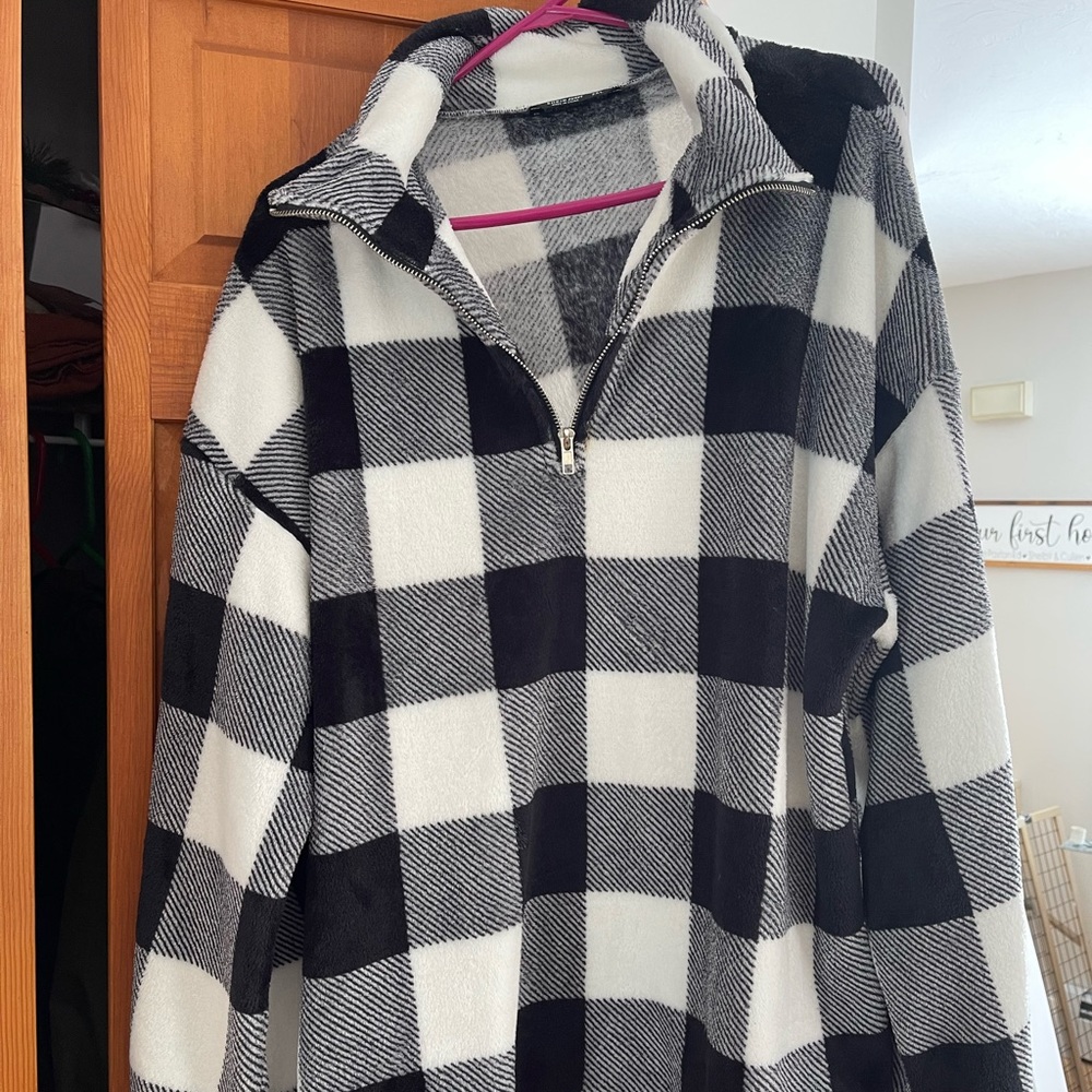 3/4 zip up black plaid sweatshirt.